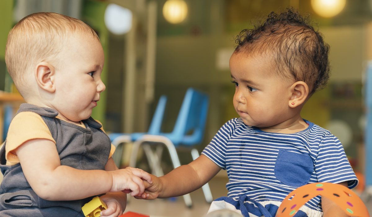 Babys playing together in the kindergarten.